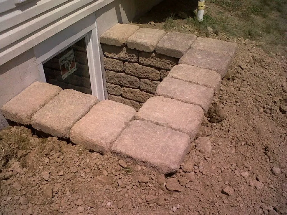Custom stone area wall after backfilling