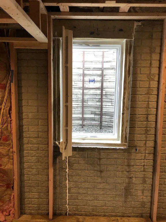 Single hung inswing casement egress window in open position for egress
