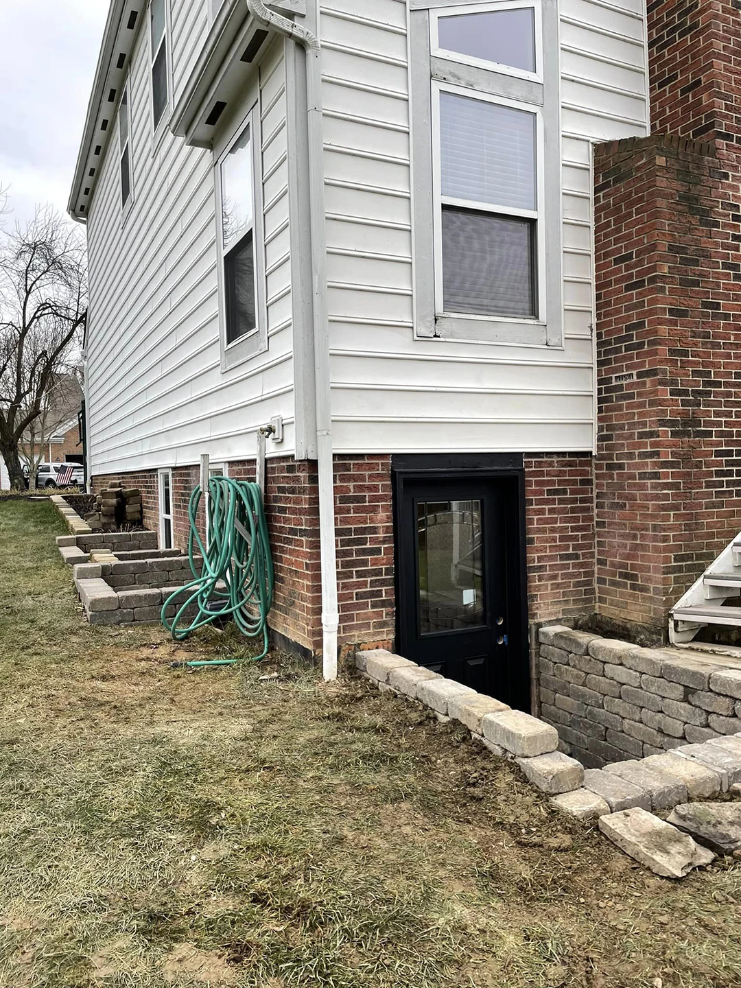 Edington Stone Egress Window Wells and Walk-Out Basement Door with Steps