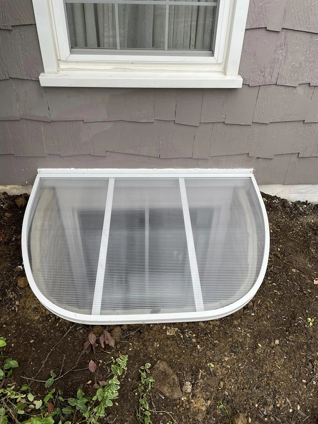 Buried Egress Window Wells with Covers