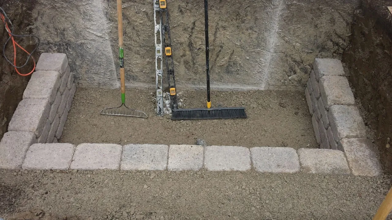 First courses of a custom retaining wall window well